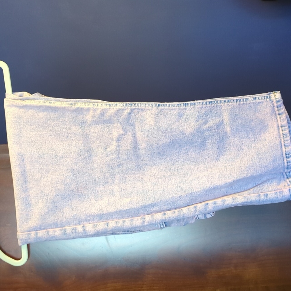 Women's pink and blue faded jeans.